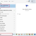 Tìm kiếm 'reliability' trong ô tìm kiếm của Start Menu Windows để mở Reliability Monitor.