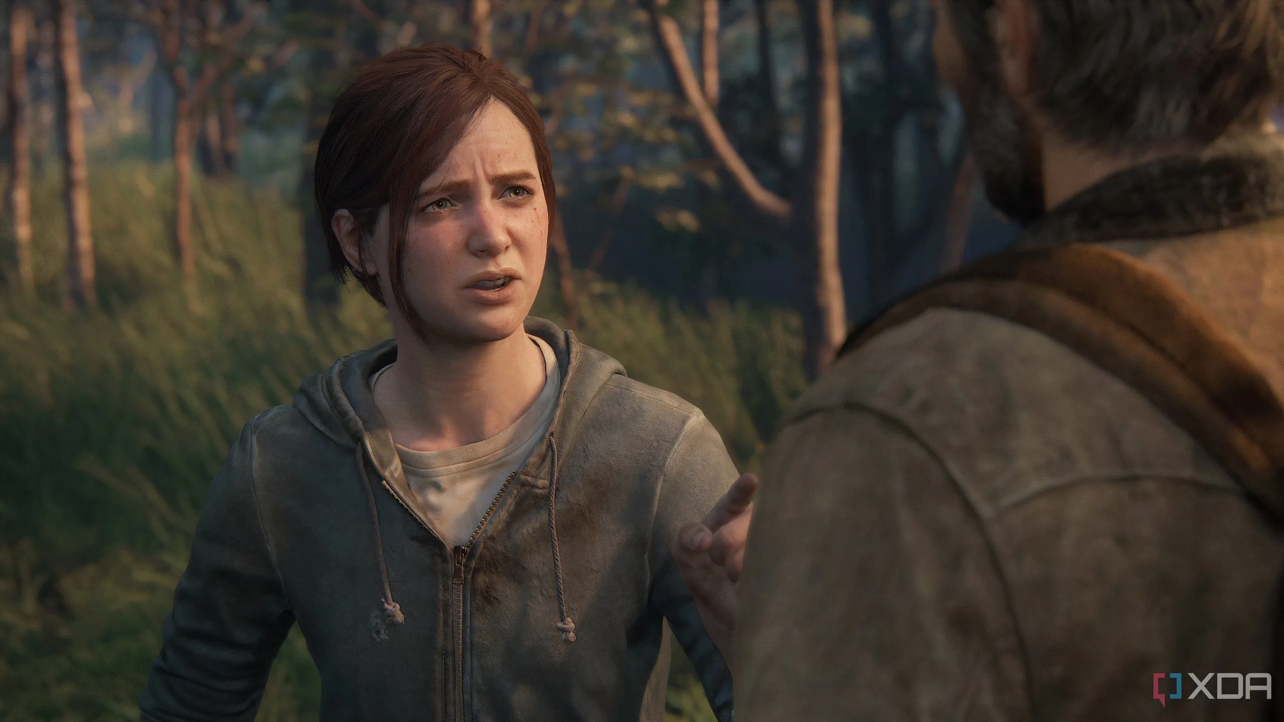 A screenshot from the game The Last of Us Part II Remastered on PC, showing an emotional conversation between Ellie and Joel.
