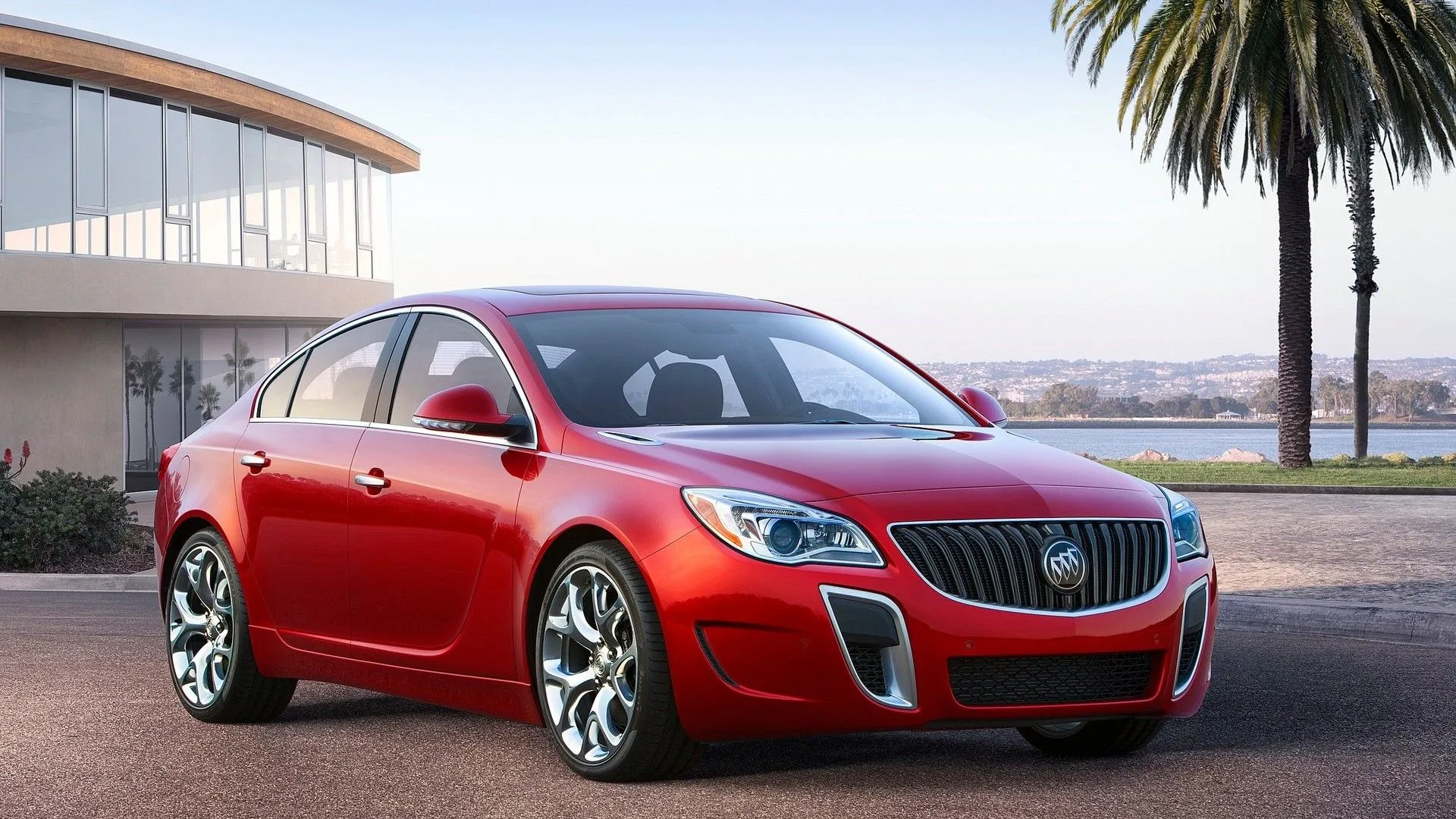 Ảnh cận cảnh góc 3/4 phía trước của một chiếc Buick Regal đời 2014 màu đen, thể hiện thiết kế cổ điển nhưng vẫn tinh tế của dòng xe sedan cỡ trung của Mỹ.