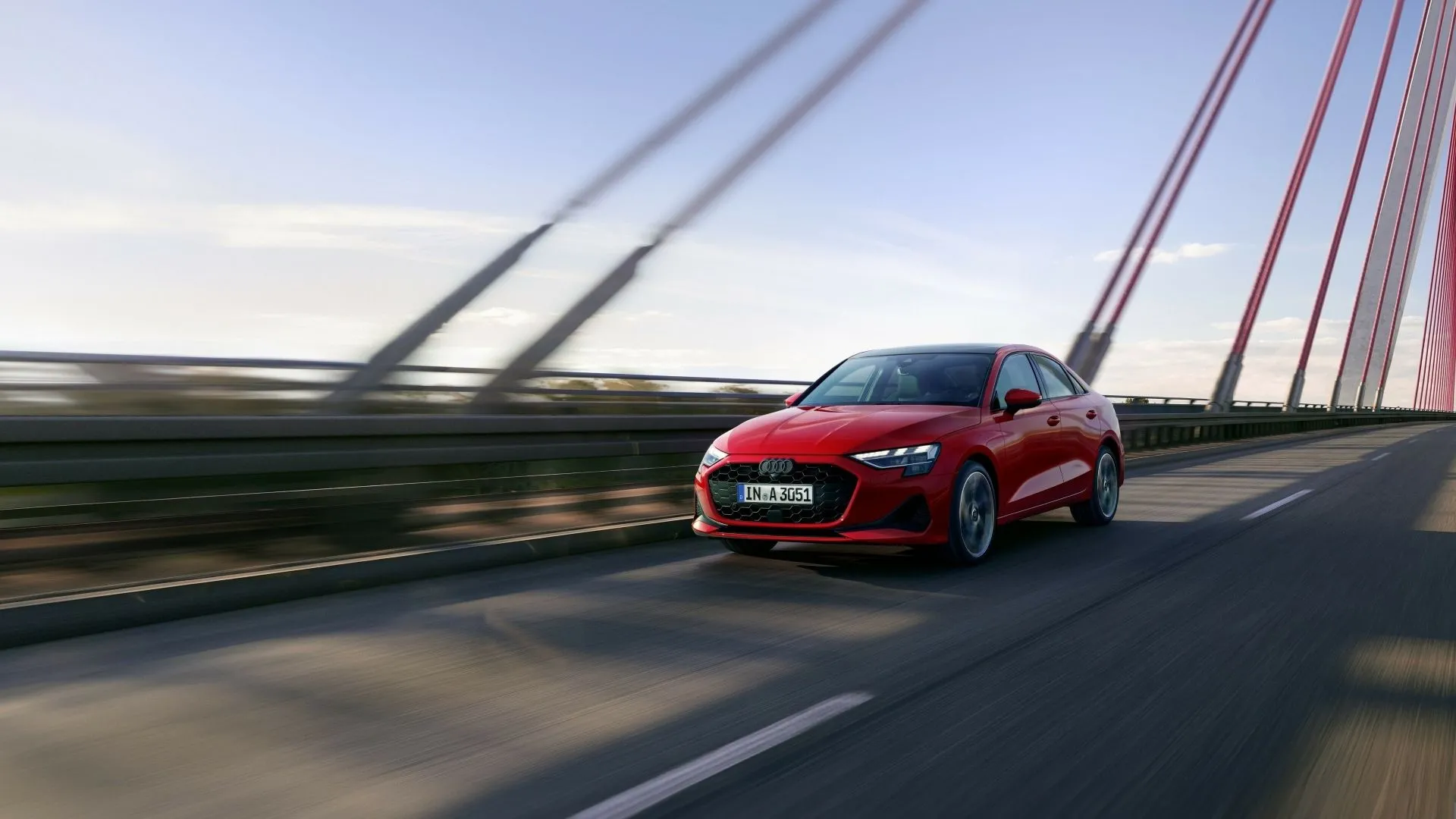Audi A3 2025 màu xanh ngọc, góc 3/4 phía trước, đang di chuyển trên đường