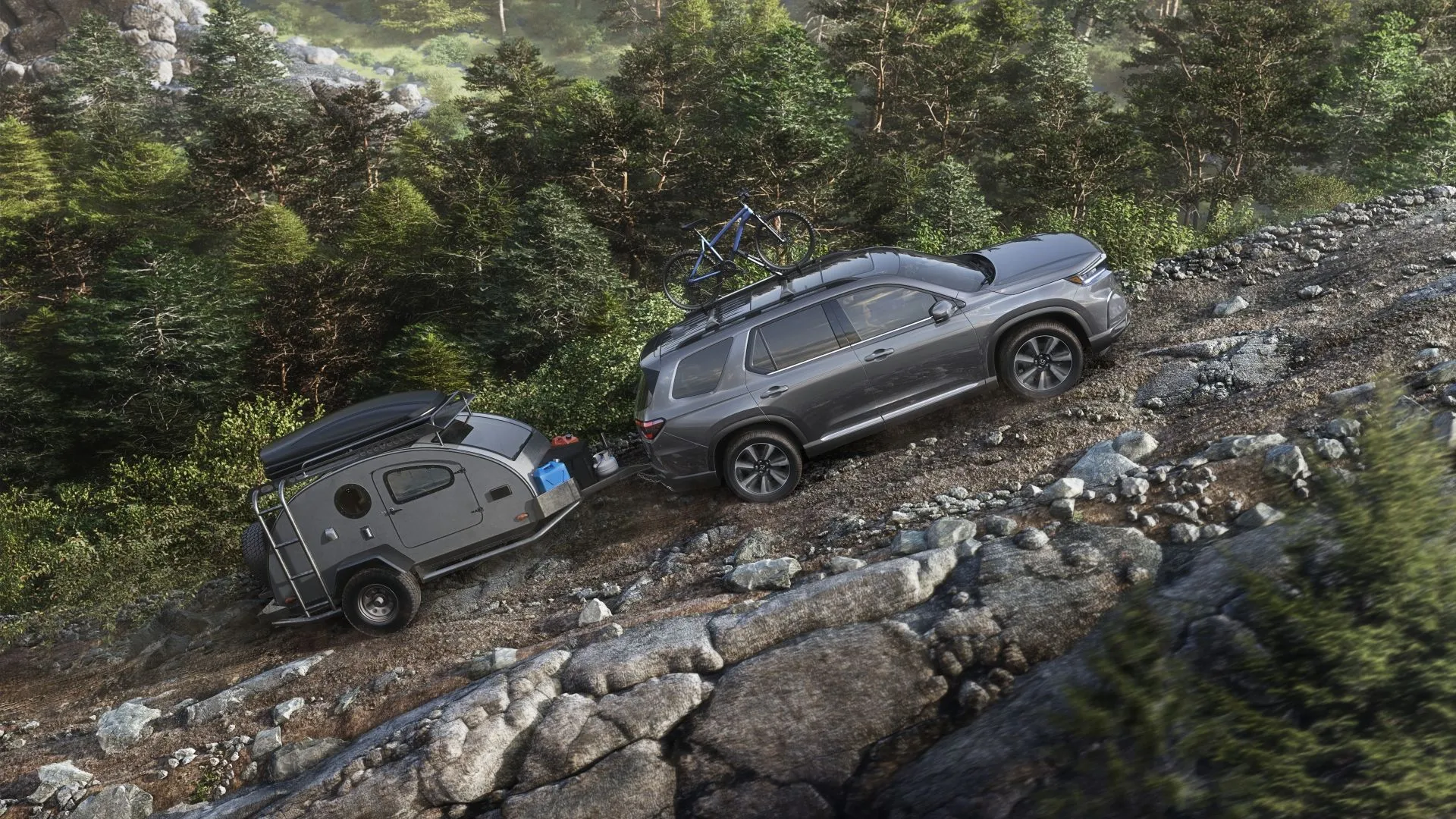 Honda Pilot Elite 2023 kéo rơ-moóc trên địa hình đồi núi, minh họa sức mạnh động cơ V6 và khả năng kéo vượt trội.