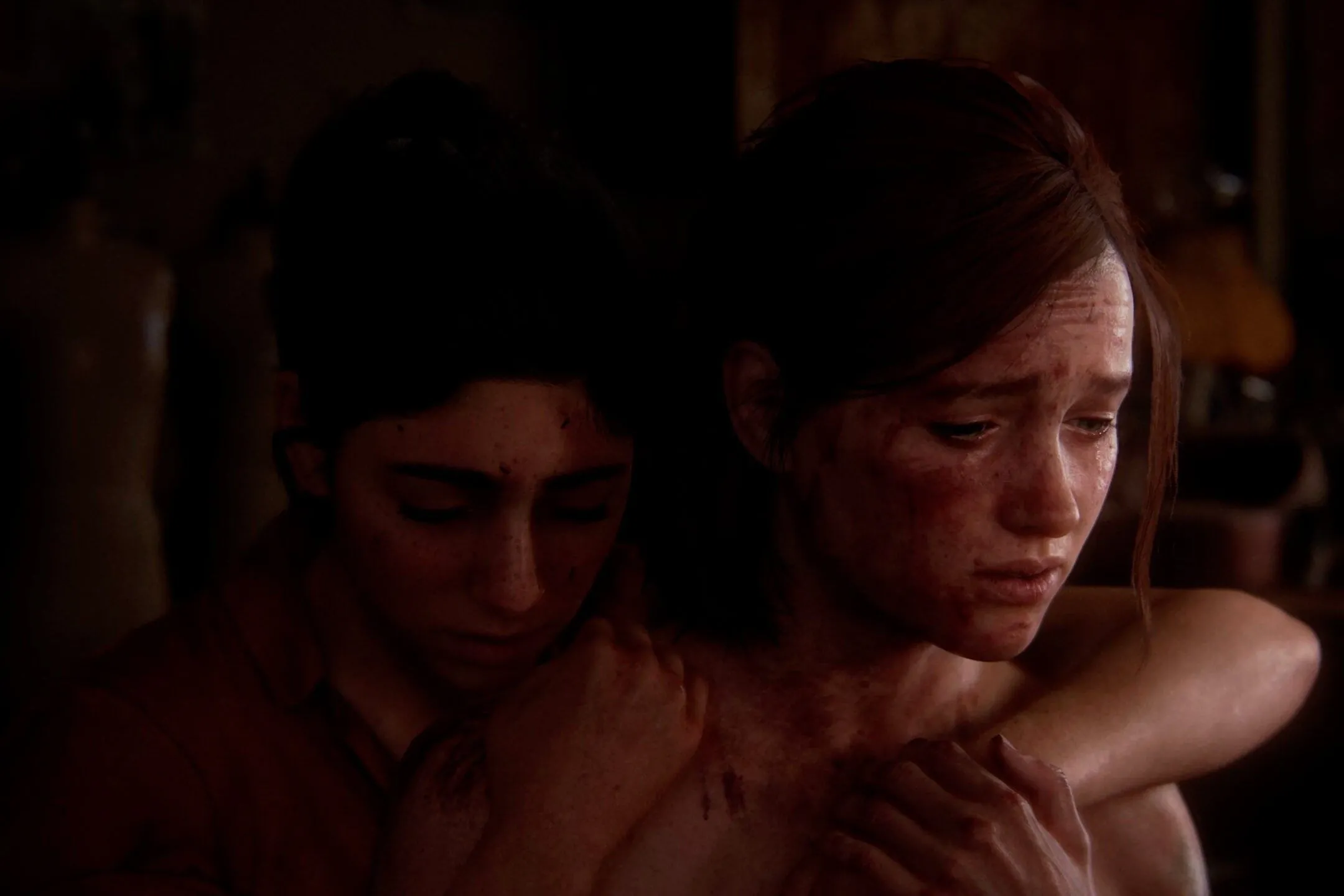 Khoảnh khắc Ellie và Dina ôm nhau, thể hiện mối quan hệ sâu sắc trong The Last of Us Part II