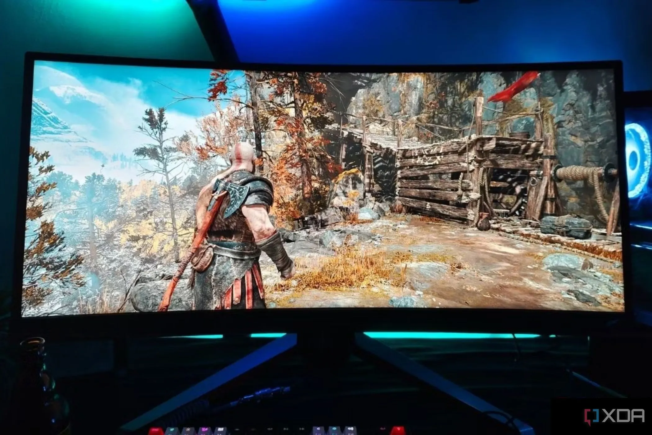 Màn hình BenQ Mobiuz EX3415R ultrawide cong hiển thị cảnh game God Of War