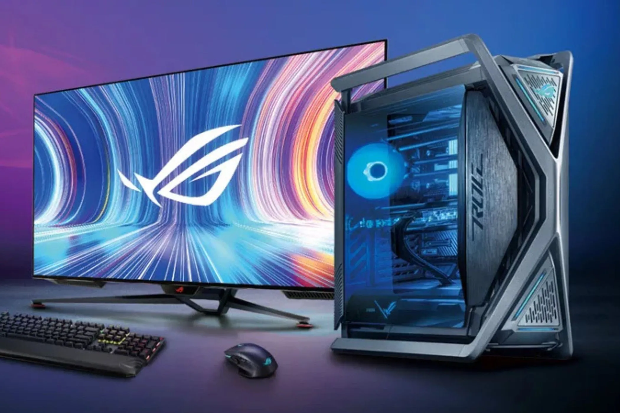 Máy tính PC trên bàn làm việc với màn hình và bàn phím gaming