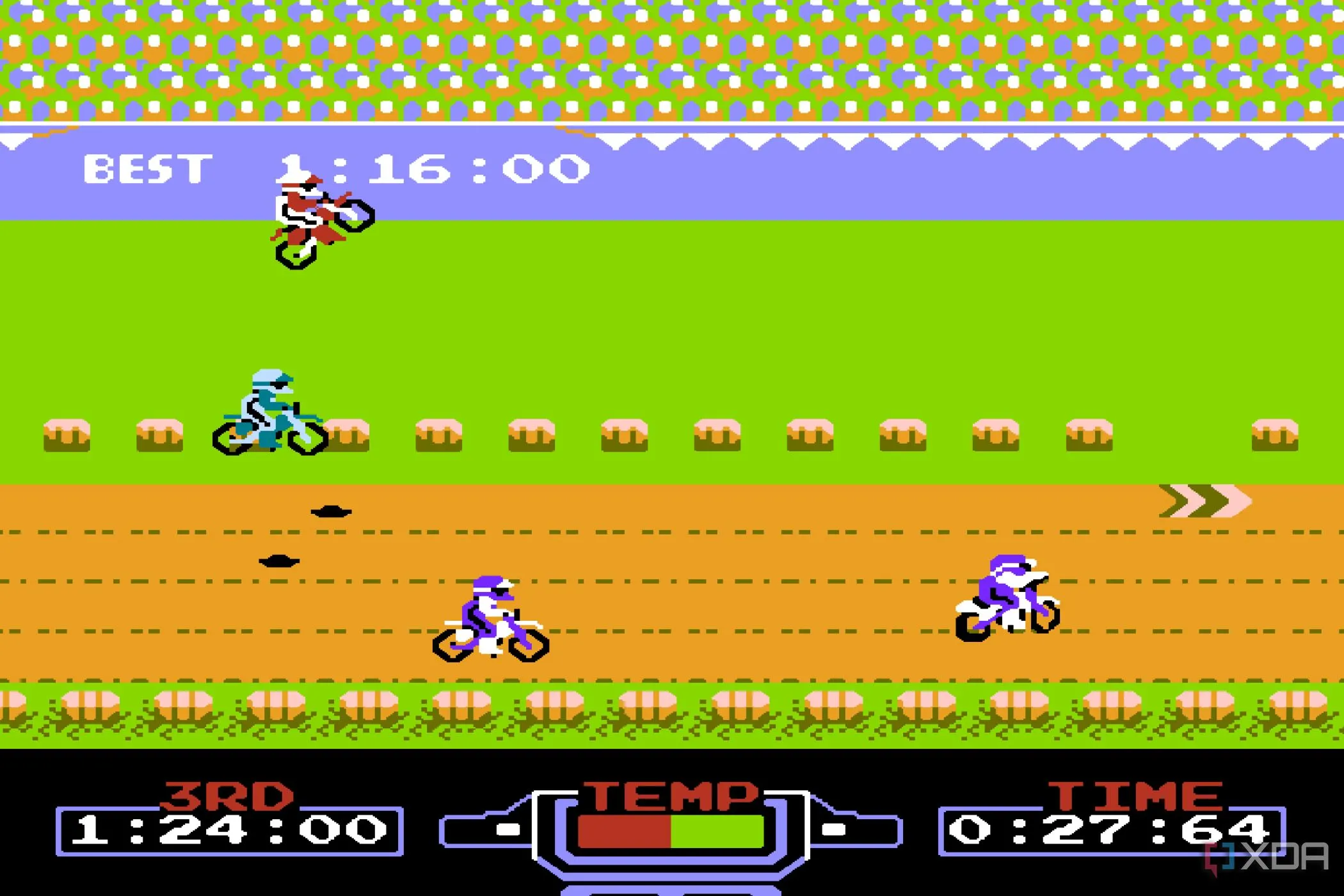 Một tay đua xe địa hình đang bay trên không vượt qua chướng ngại vật trong game Excitebike cổ điển trên hệ máy NES.