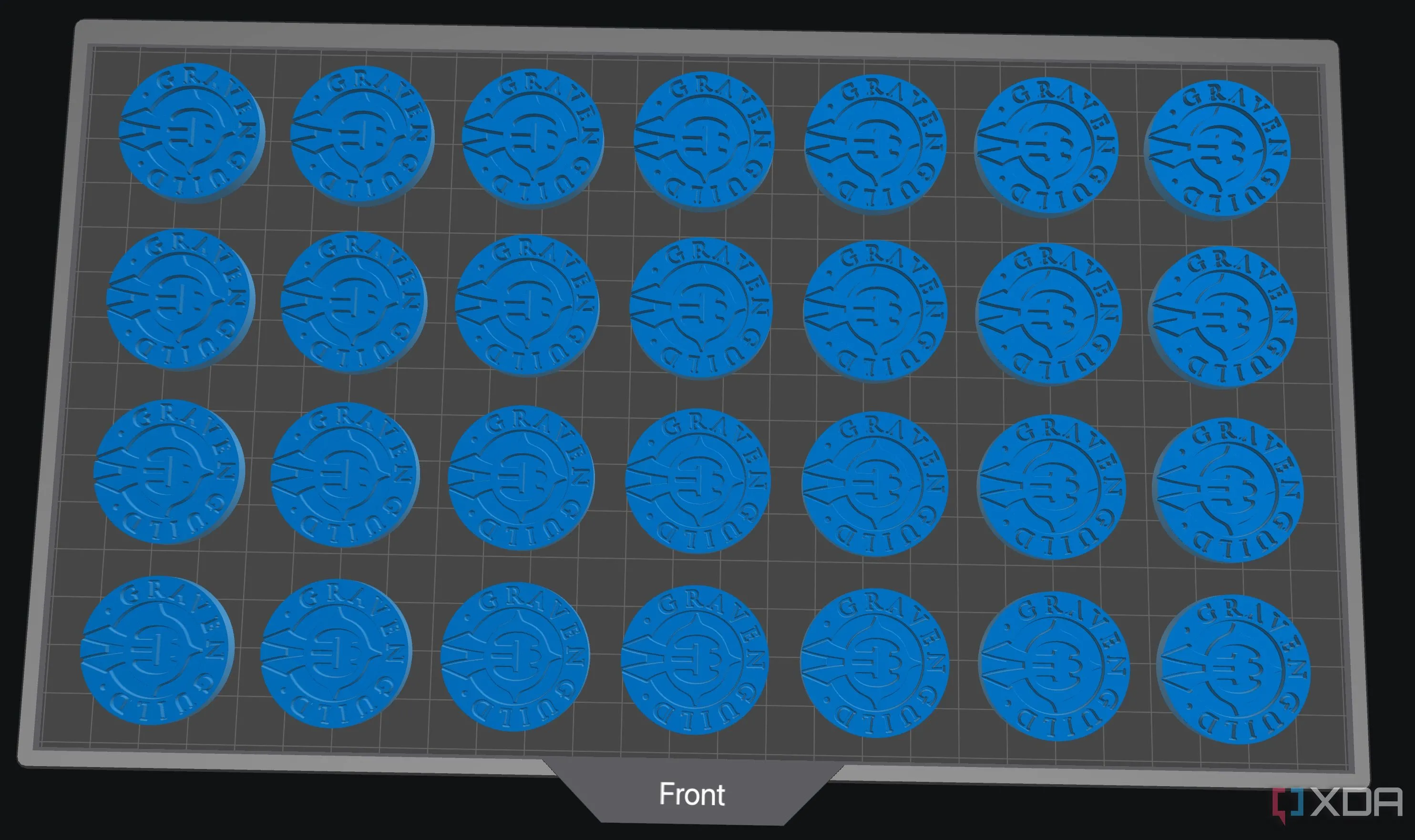 Nhiều mô hình token nhỏ được in đồng thời trên máy in 3D resin, chứng minh tốc độ sản xuất hàng loạt nhanh chóng và hiệu quả của công nghệ này.