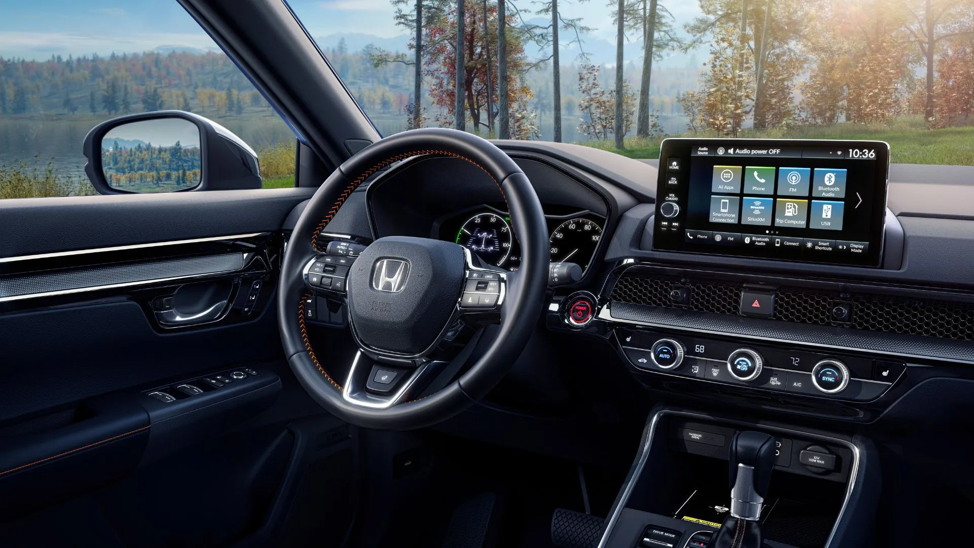 Nội thất Honda CR-V Sport Touring 2025 với vô lăng, màn hình thông tin giải trí và các nút điều khiển