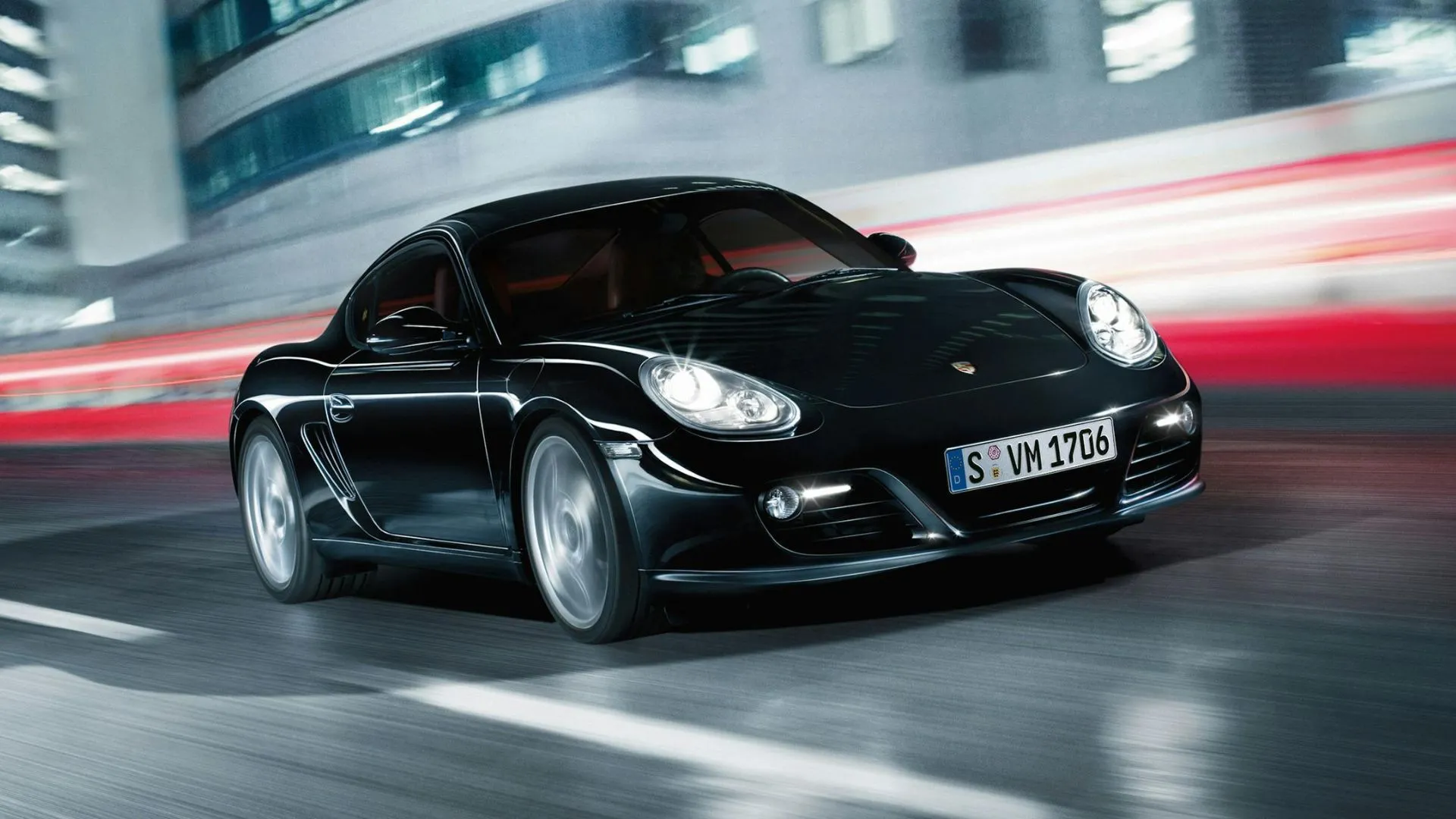 Porsche Cayman Coupe 2014 màu đen trên đường đua, mẫu xe thể thao hạng sang với khả năng xử lý đỉnh cao