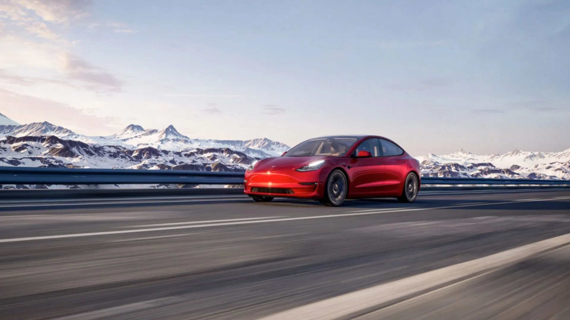 Tesla Model 3 2023 di chuyển mượt mà trên đường với khung cảnh núi tuyết hùng vĩ