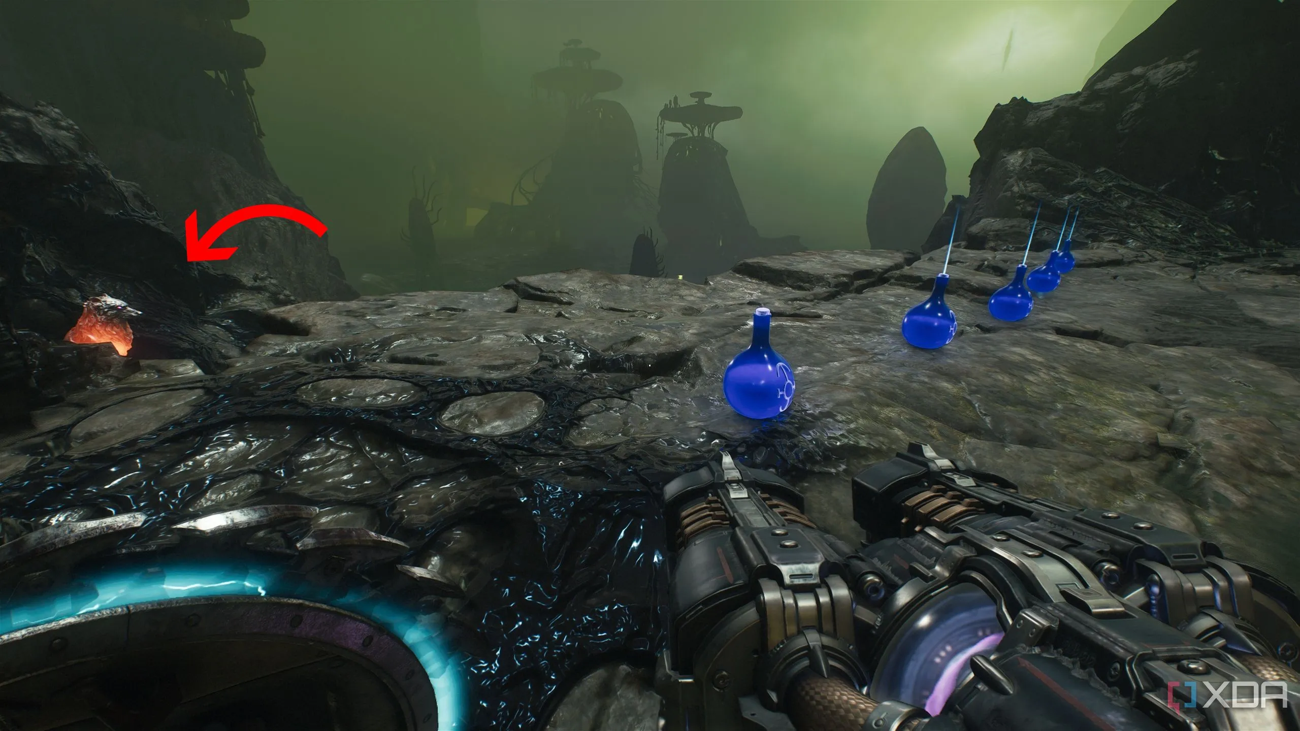 Tượng sói thứ tư ló ra sau các bình máu dọc vách đá trong Chương 16 Doom The Dark Ages