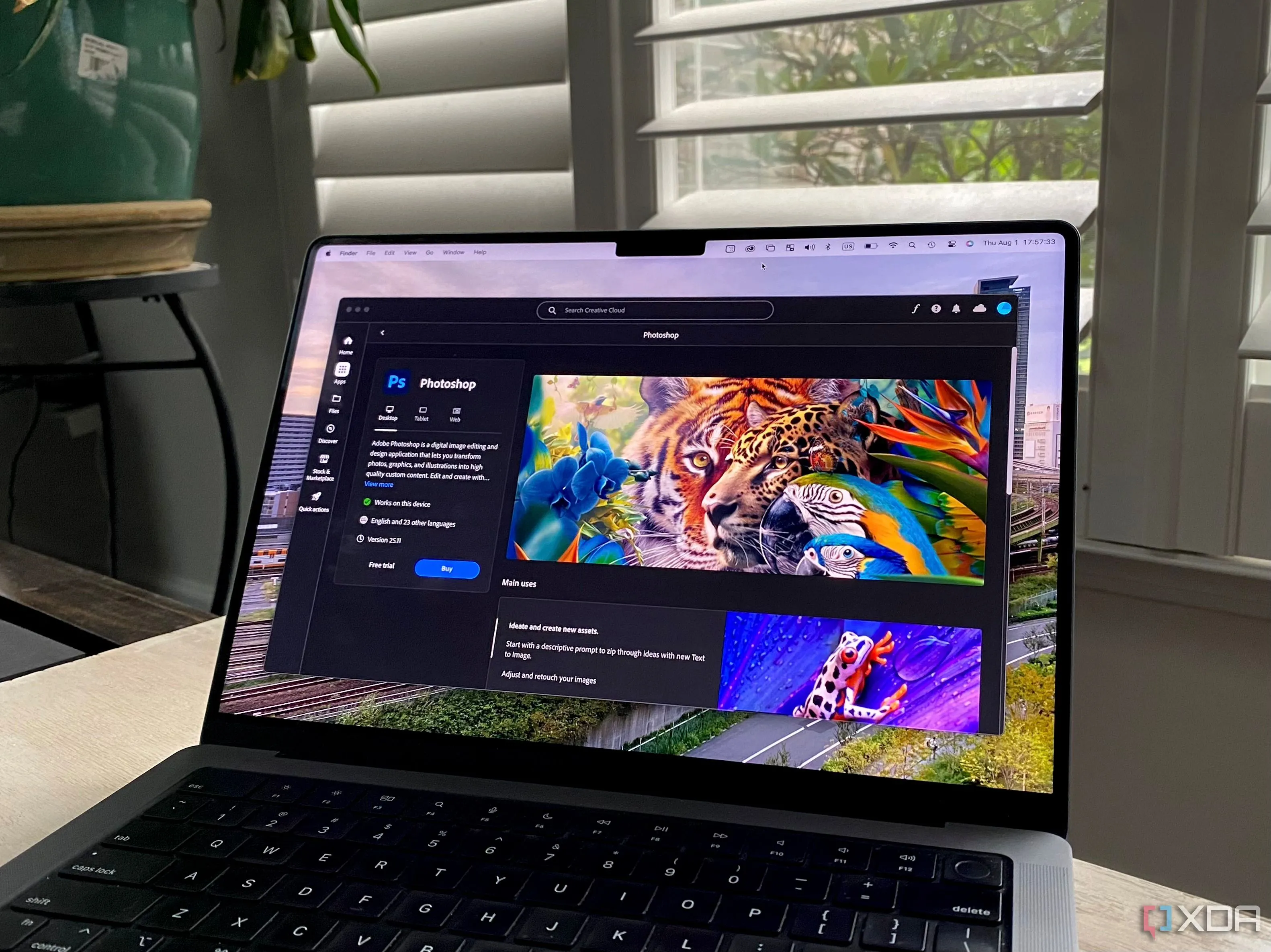 Ứng dụng Adobe Creative Cloud hiển thị giao diện Photoshop trên MacBook Pro, minh họa công cụ sáng tạo
